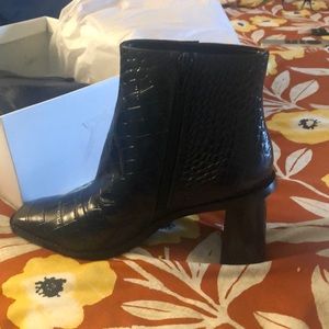 Booties, Black, zipper on the side, Brand New never worn.
